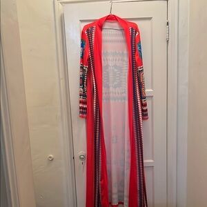 Red and Blue Striped Cape with Flowing Silhouette